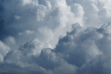 Puffy cumulus clouds on sunlight..