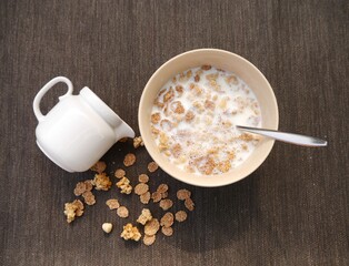 High view angel milk  and cereal on the table.
