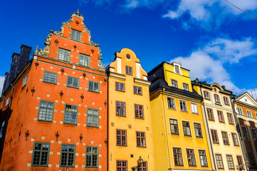 Red and Yellow iconic buildings on Stortorget,  a small public square in Gamla Stan, the old town in central Stockholm, Sweden.