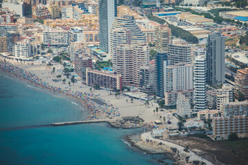 Summer view of Calpe town, Calp, with harbor and beach and  Penon de Ifach mountain,  Marina Alta, province of Alicante, Valencian Community, Spain
