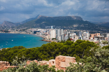 Summer view of Calpe town, Calp, with harbor and beach and  Penon de Ifach mountain,  Marina Alta, province of Alicante, Valencian Community, Spain