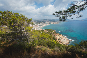 View of Calpe Calp town with Penon de Ifach mountain during the hiking to Penyal d'Ifac Natural Park, Marina Alta, province of Alicante, Valencian Community, Spain