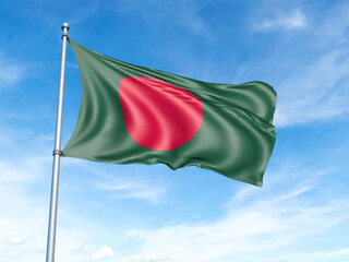 Naklejka na ściany i meble Bangladesh flag on a pole against a blue sky background.