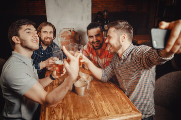 Happy meet old male friends in bar make selfie photo on phone. Concept of friendship