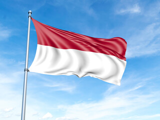 Indonesia flag on a pole against a blue sky background.