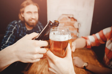 Meet friends of men in beer bar, happy smiles on your face. Concept hug holiday