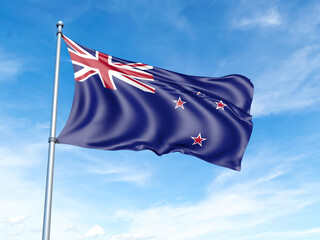 New Zealand flag on a pole against a blue sky background.
