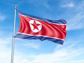 Fototapeta na wymiar North Korea flag on a pole against a blue sky background.