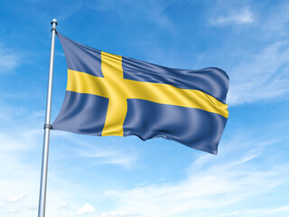 Sweden flag on a pole against a blue sky background.