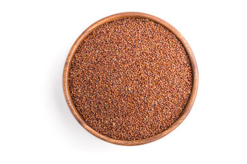 Wooden bowl with raw red quinoa seeds isolated on white background. Top view.