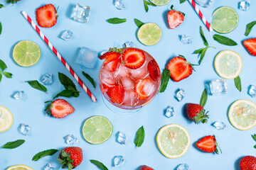 Refreshing cocktail drink flat lay on colorful pattern summer fruit background.