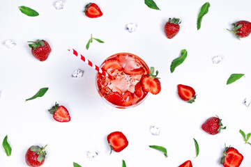 Refreshing strawberry cocktail drink flat lay on pattern summer fruit background.