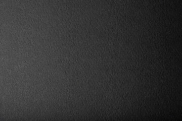 Close-up of sheet of black gradient paper texture