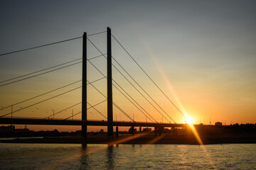 Fototapeta na wymiar Stock Photo - View of Oberkassel bridge at sunset in Dusseldorf, Germany
