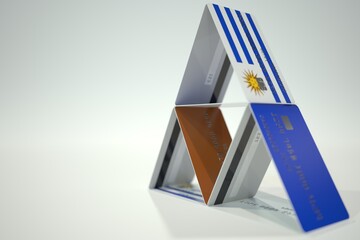 National flag of Uruguay on credit card house, fictional data. Risky financial decisions related 3D rendering