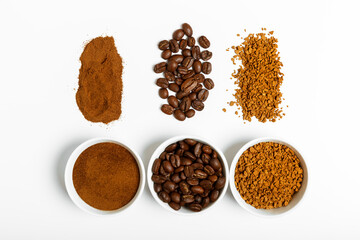 coffee beans, ground and black coffee or espresso in mugs and sprinkled on a white background. coffee shop or store concept. flat lay, top view.