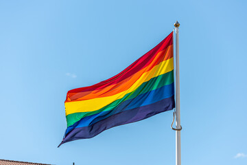 HBTQ rainbow flag waving proudly in the breeze