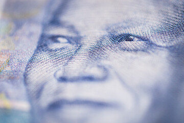 Horizontal marco detail of the image of Nelson Mandela in the obverse of South African ZAR banknote...