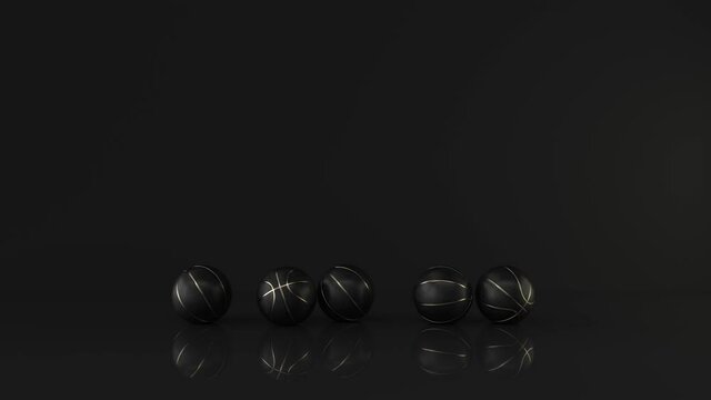 Black Basketball with Gold Metallic Line Design on dark Background. Futuristic sports concept. Fall alternately down to the floor. View front. 3D rendering animation in 4K