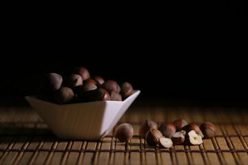 Hazelnuts, filbert on old wooden table. heap or stack of hazel nuts. Hazelnut background, healty food