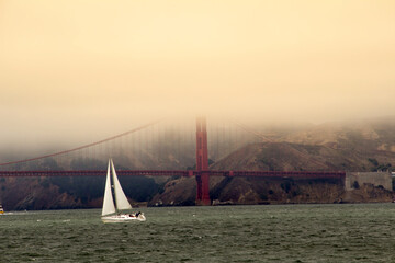 Sailboat on the Ocean, bay of San Francisco, Golden Gate Bridge background