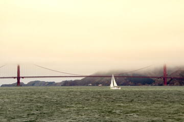 Sailboat on the Ocean, bay of San Francisco, Golden Gate Bridge background