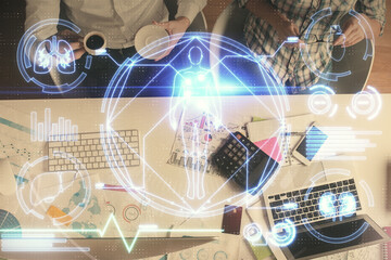 Double exposure of man and woman working together and education theme hologram drawing. Computer background. Top View.