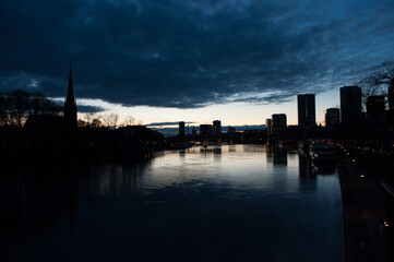 Fototapeta premium Spectacular view on the night city of Frankfurt reflecting in the river