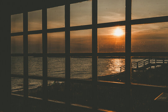 Spectacular view on the sunset through the  window