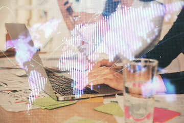 Double exposure of woman hands typing on computer and business theme hologram drawing. Success concept.