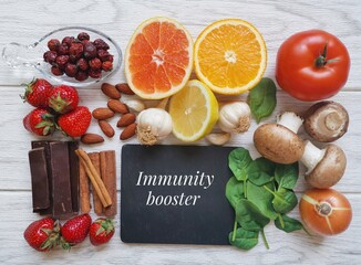 Immune-boosting foods. Assortment of food to naturally boost immune system. Foods high in vitamin and mineral for strong immune system. Concept of helpful ways to strengthen immunity naturally.