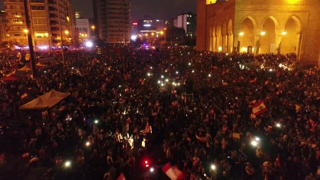 Beirut, Lebanon 2019 : night drone shot of Martyr square, during the Lebanese revolution, with thousands of protesters revolting against government failure and corruption