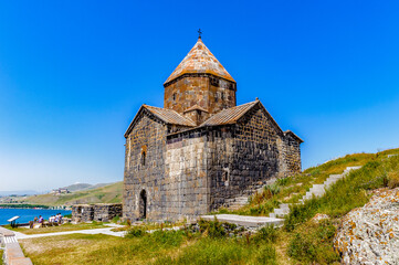 Fototapeta na wymiar It's Sevanavank (Sevan Monastery), a monastic complex located on a shore of Lake Sevan in the Gegharkunik Province of Armenia