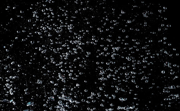 Water bubbles isolate on black background.