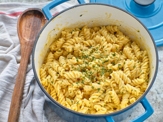 macaroni and cheese baked in dutch oven with parsley