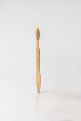 ecological wooden toothbrush on white background