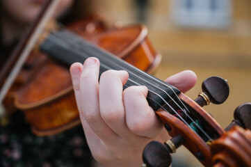 Violin close-up, woman playing the violin.