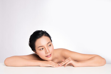 Fototapeta premium Beautiful Young Asian Woman with Clean Fresh Skin. Face care, Facial treatment, Cosmetology, beauty and healthy skin and cosmetic concept, woman beauty skin isolated on white background.