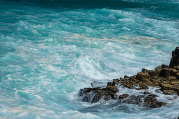 waves crashing on rocks
