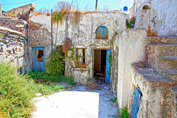 Old and run down parts of the traditional village of Megalochori in Santorini, Greece.