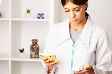 The ophthalmologist advises the patient by phone, helping with the choice of contact lenses for vision