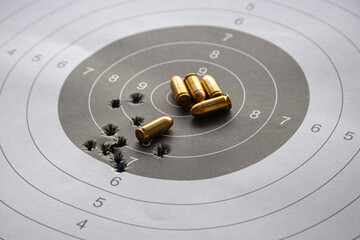 bullets on paper target for shooting practice