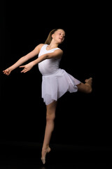 Full length portrait of a charming gymnast girl in elegant dress.