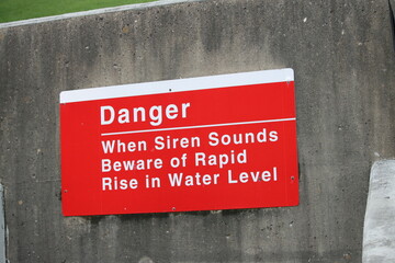Danger When Siren Sounds Beware of Rapid Rise In Water Level Sign