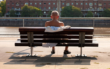 Fototapeta na wymiar Man turning his back sitting on a bench.