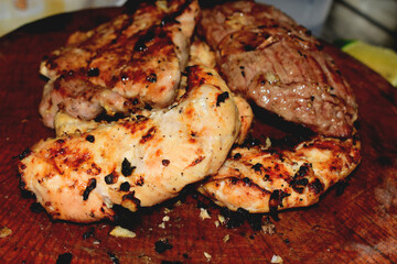 Grilled chicken and pork grilled on wood