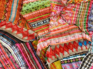 Colorful fabric of Mhong hill tribe textiles background.