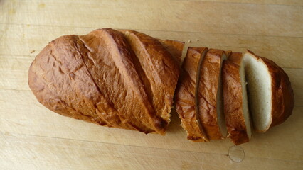 cut a loaf of bread from wheat flour
