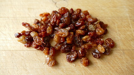 dried raisins on a wooden background