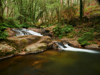River Leça Waterfalls in Monte Cordova, Portugal. The river water runs down the big rocks of the...